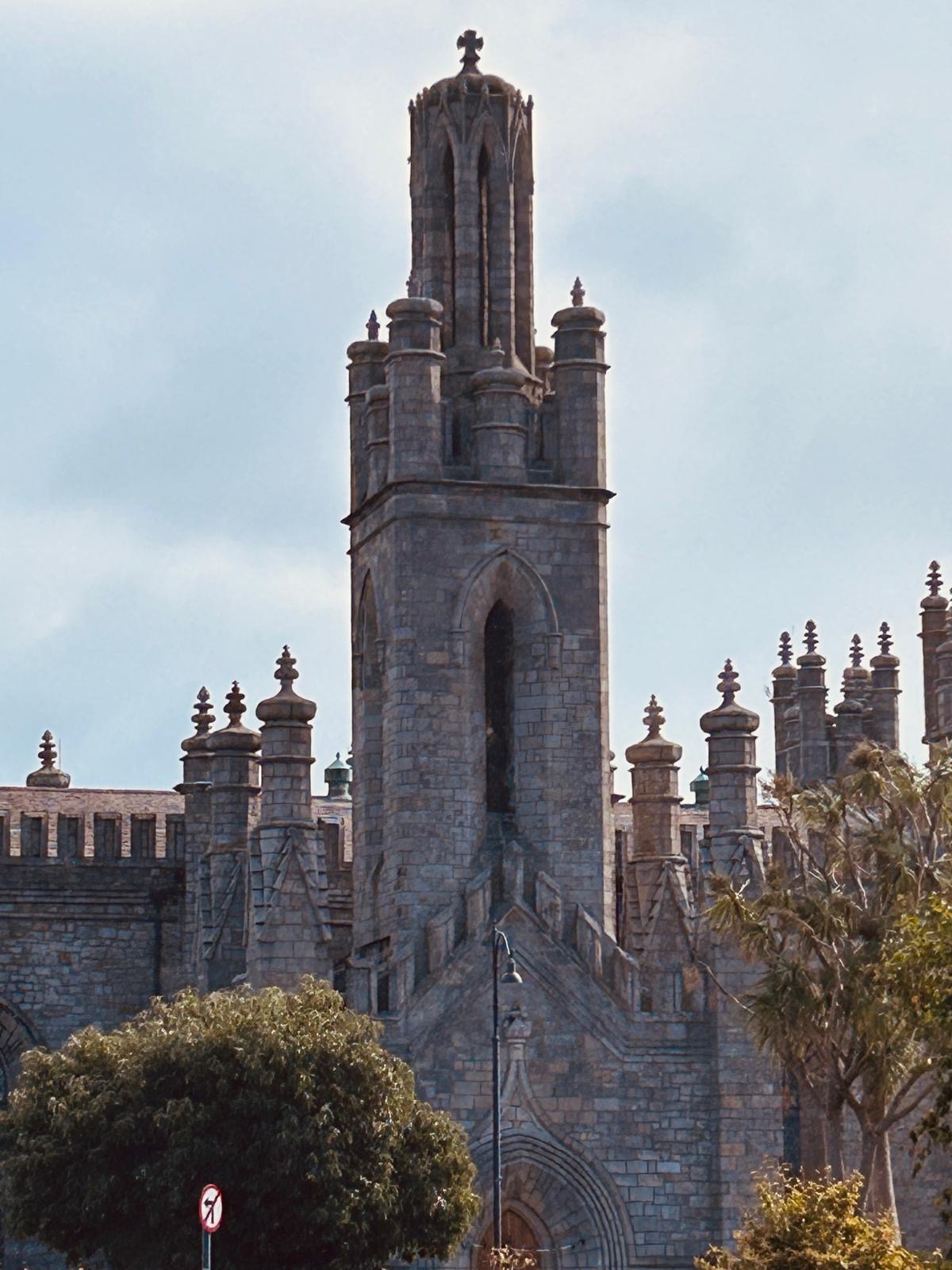 The granite church tower beside the Schoolhouse in Monkstown